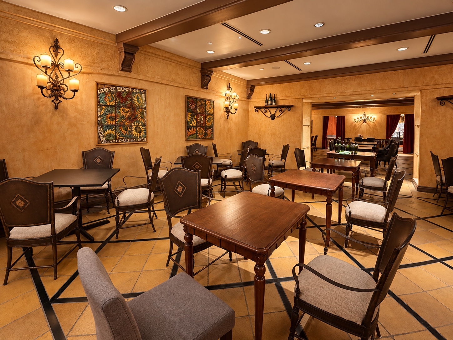 La Parrilla’s warm dining room with dark wooden tables and glowing wall lights