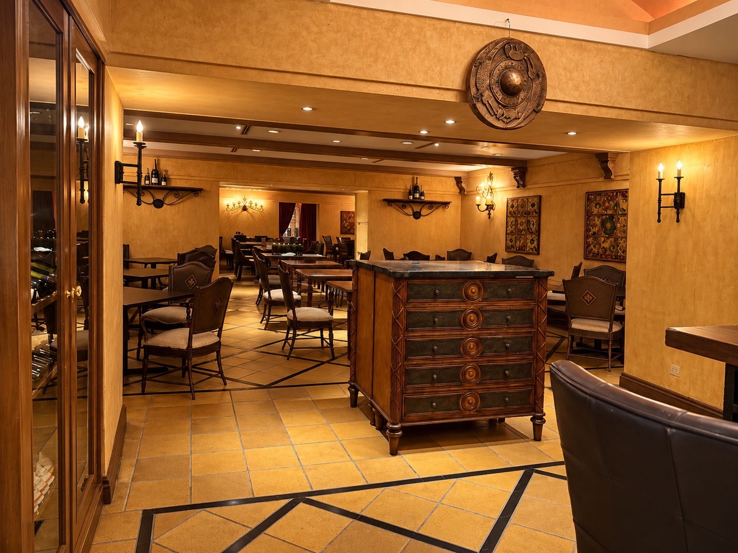 The dining room at La Parrilla, featuring warm gold walls and traditional wooden furniture